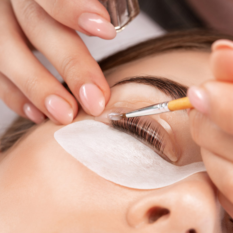 woman getting eyelash treatment