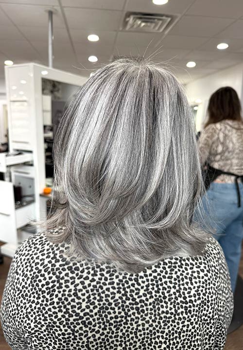 Layered silver gray haircut, back view.